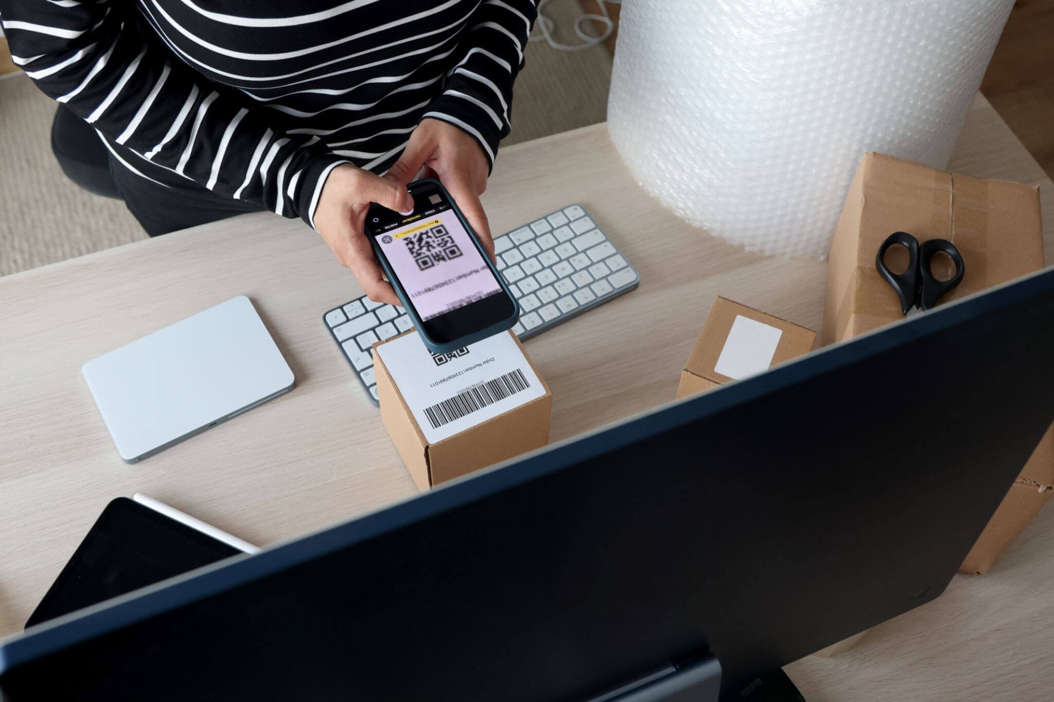 taking a photo with phone of qr code on box