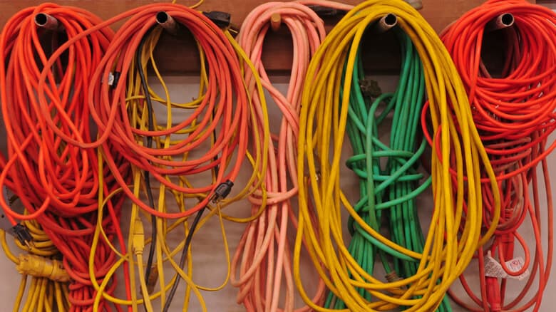 extension cords hanging on wall