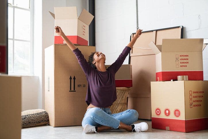 woman with boxes in apartment