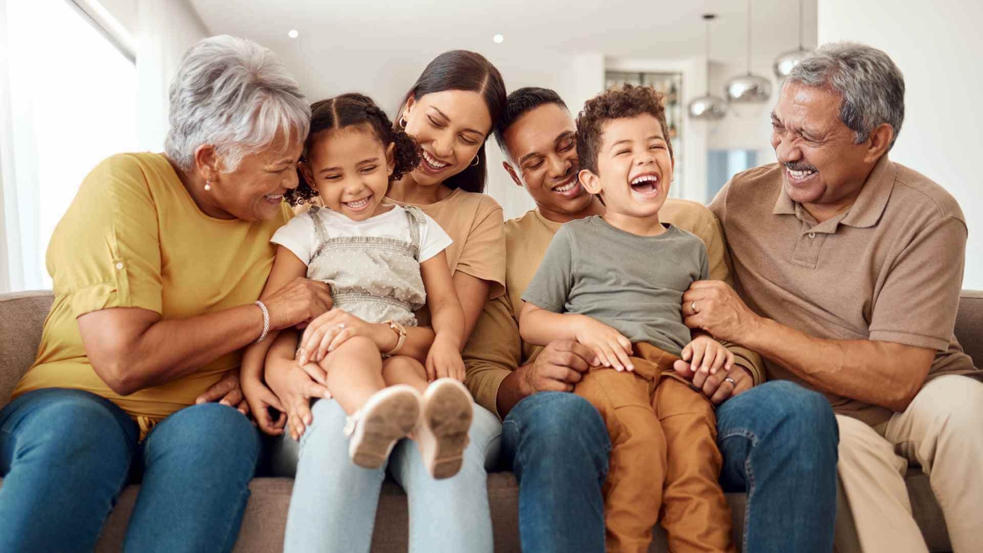 parents, grandparents, and kids on couch