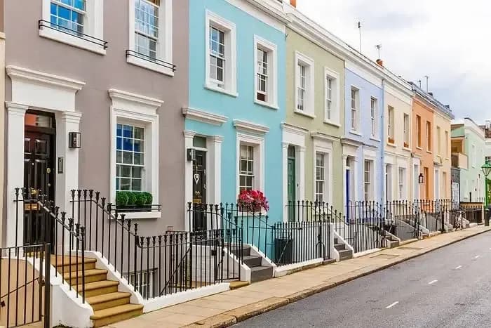row of different colored townhomes