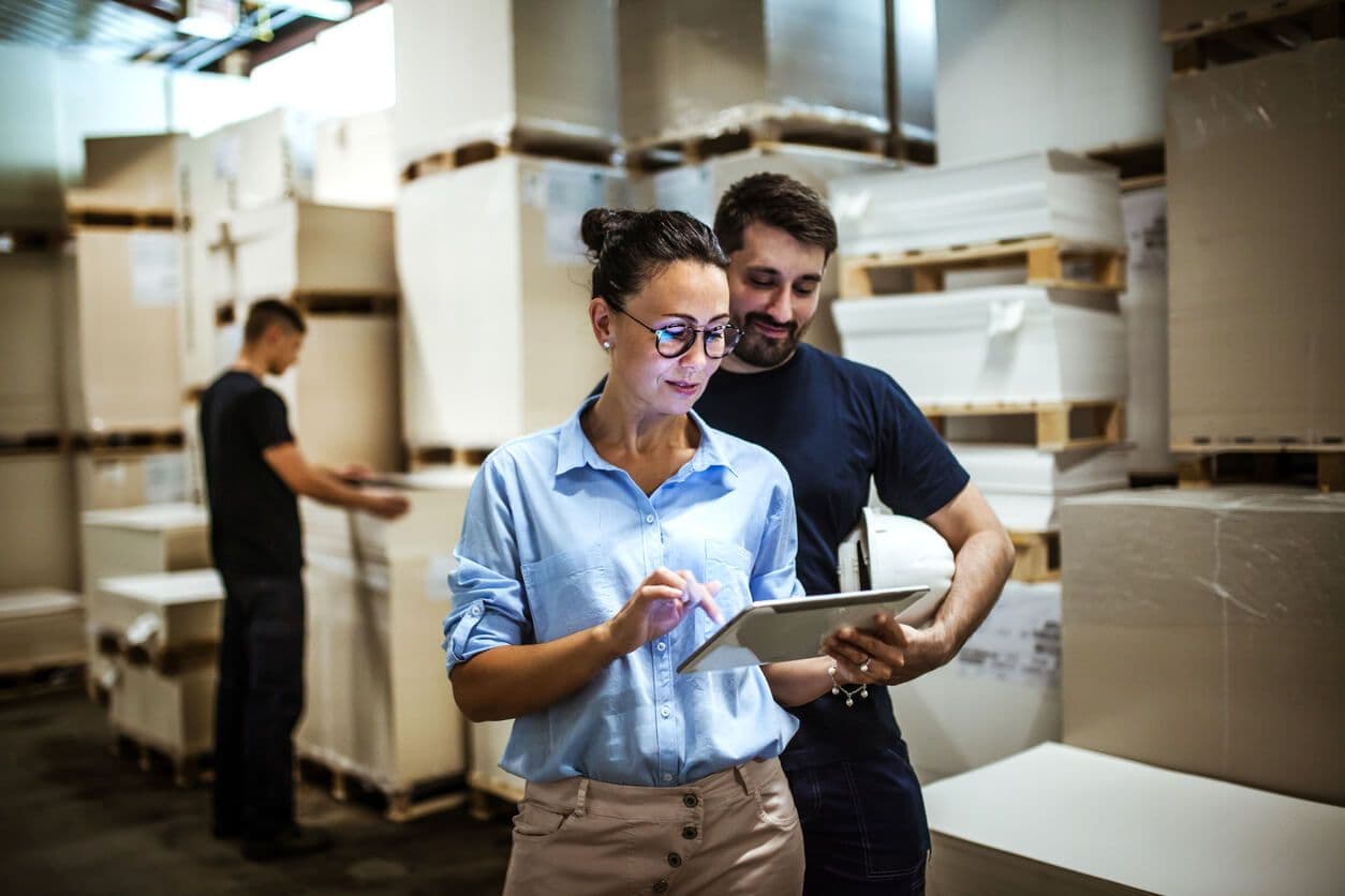 man and woman in backroom with boxes