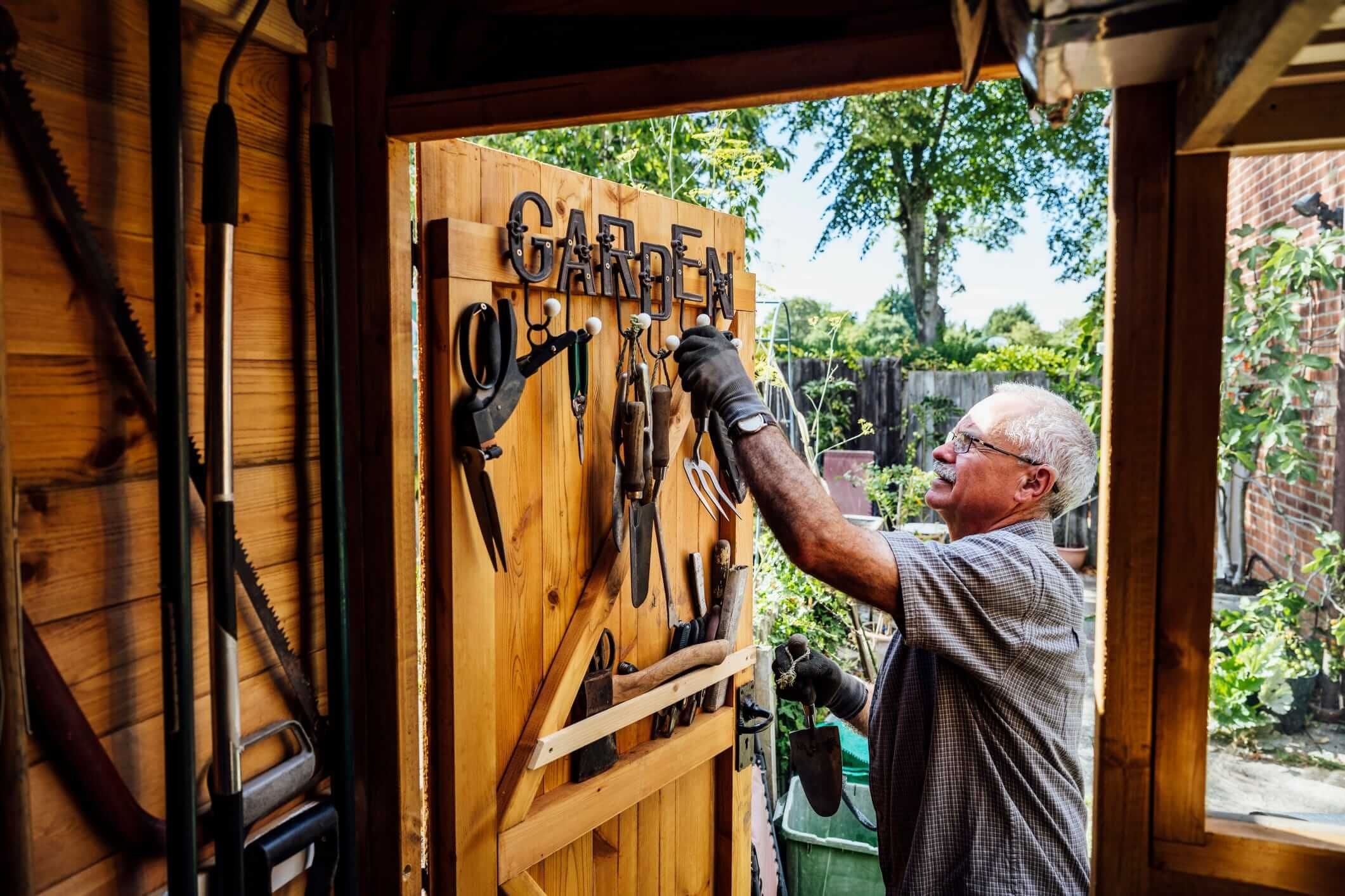 older man organization his shed wall
