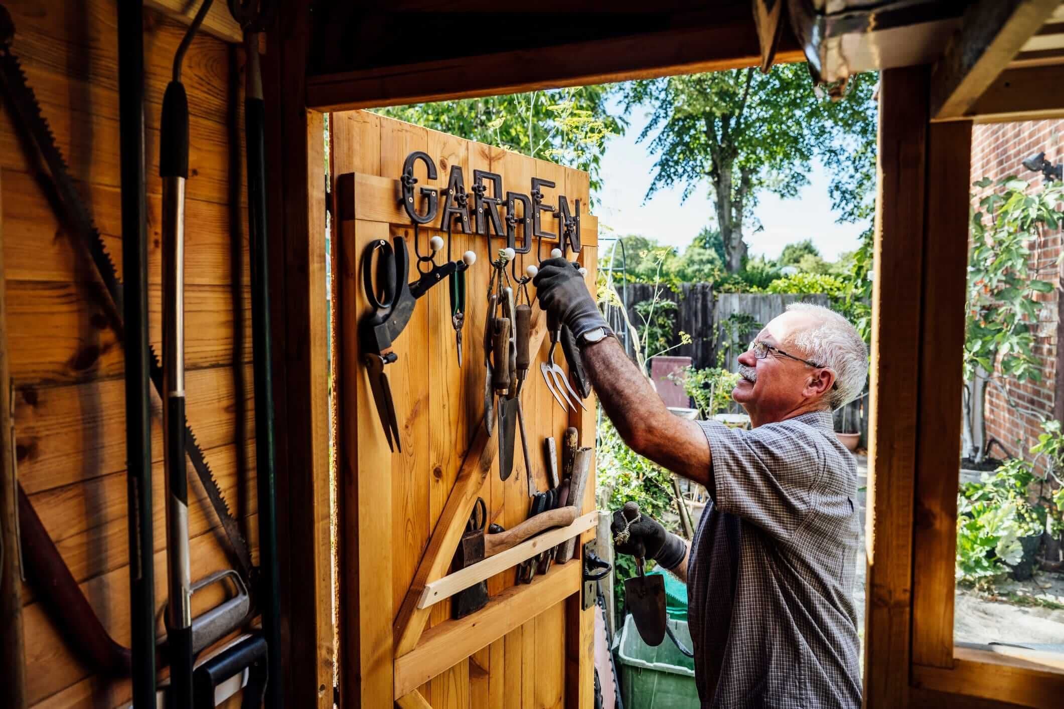 older man organization his shed wall